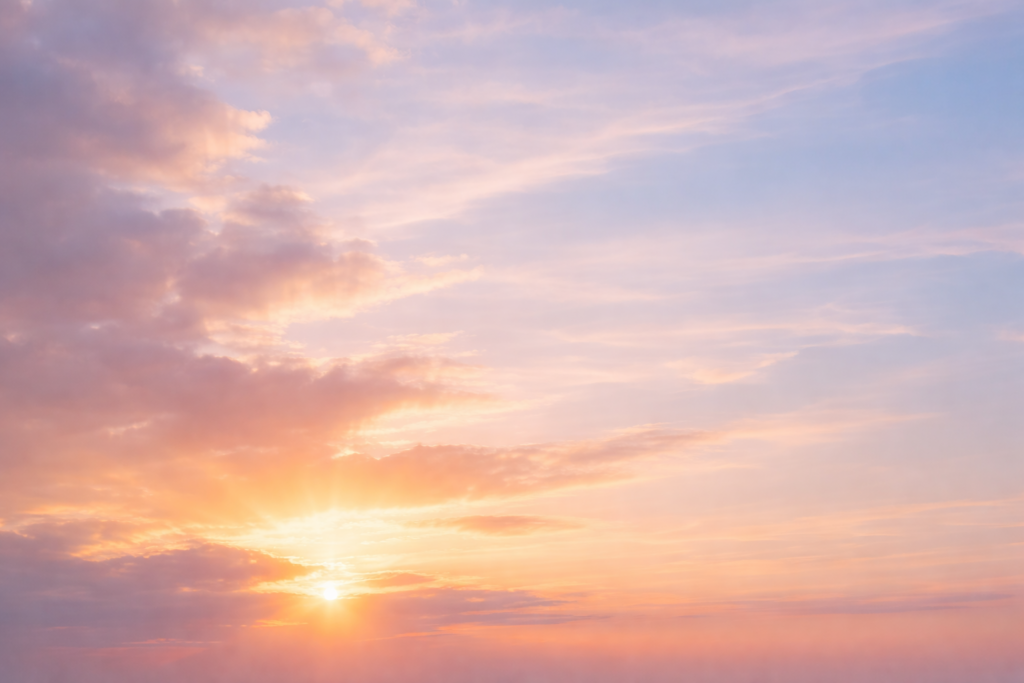 Soft sunrise breaking through pastel clouds, symbolizing steady progress and not quitting too soon.